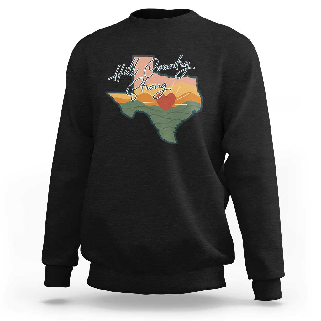 Black crewneck sweatshirt with Texas map graphic and “Hill Country Strong” text
