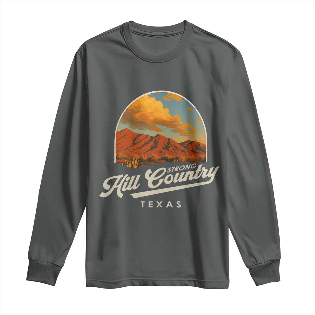 Dark heather long sleeve shirt with desert mountain logo and 'Hill Country Strong Texas' print