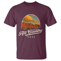 Maroon crewneck graphic T-shirt with Hill Country Texas logo and mountain art