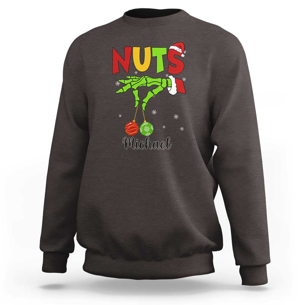 Dark gray crewneck sweatshirt with “NUTS” holiday graphic and personalized “Michael” text