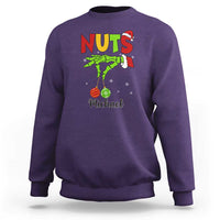 Purple crewneck sweatshirt with “NUTS” holiday graphic and personalized “Michael” text