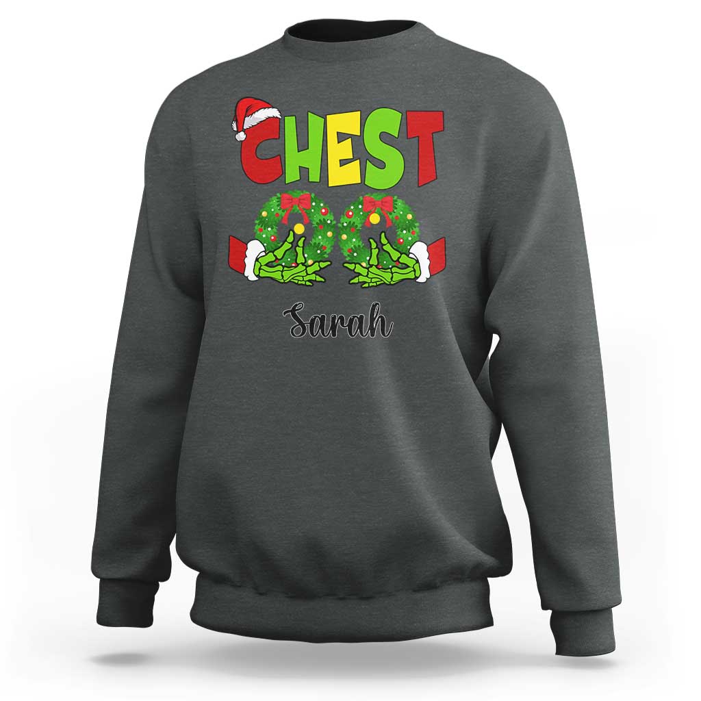 Dark heather crewneck sweatshirt with 'CHEST' and 'Sarah' Christmas graphic on front