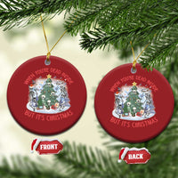 Two red round Christmas ornaments with skeleton scene; front and back shown