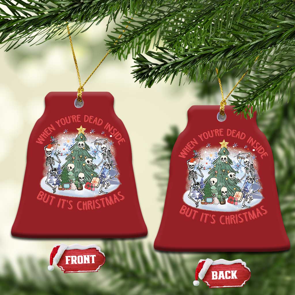 Two red bell-shaped Christmas ornaments with skeleton scene; front and back shown