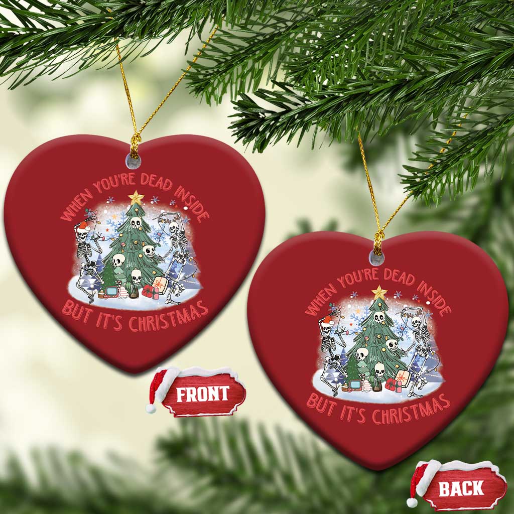 Two red heart-shaped Christmas ornaments with skeleton scene; front and back shown