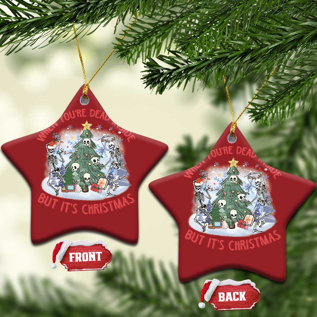 Two red star-shaped Christmas ornaments with skeleton scene; front and back shown