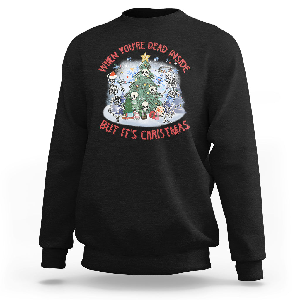 Black crewneck sweatshirt with Christmas graphic: skeletons around a tree, red/white text