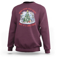 Maroon crewneck sweatshirt with Christmas graphic: skeletons around a tree, red/white text