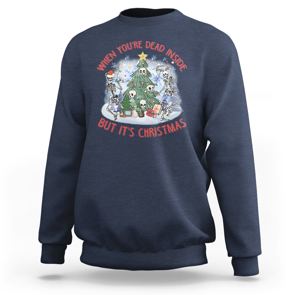 Navy crewneck sweatshirt with Christmas graphic: skeletons around a tree, red/white text