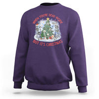 Purple crewneck sweatshirt with Christmas graphic: skeletons around a tree, red/white text