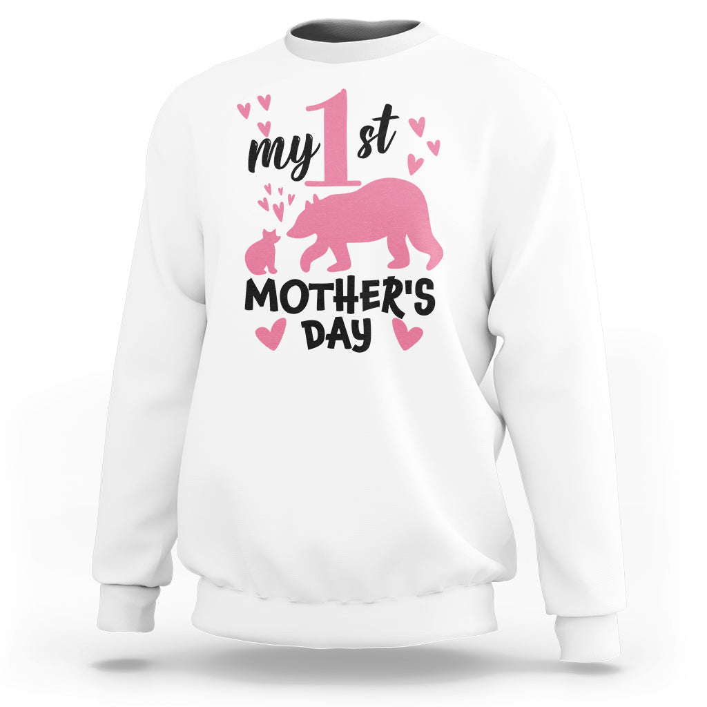 White sweatshirt with pink bear and 'My 1st Mother's Day' graphic, long sleeves.