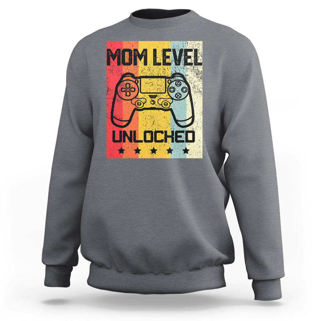 Dark heather gray crewneck sweatshirt with “Mom Level Unlocked” gaming controller graphic