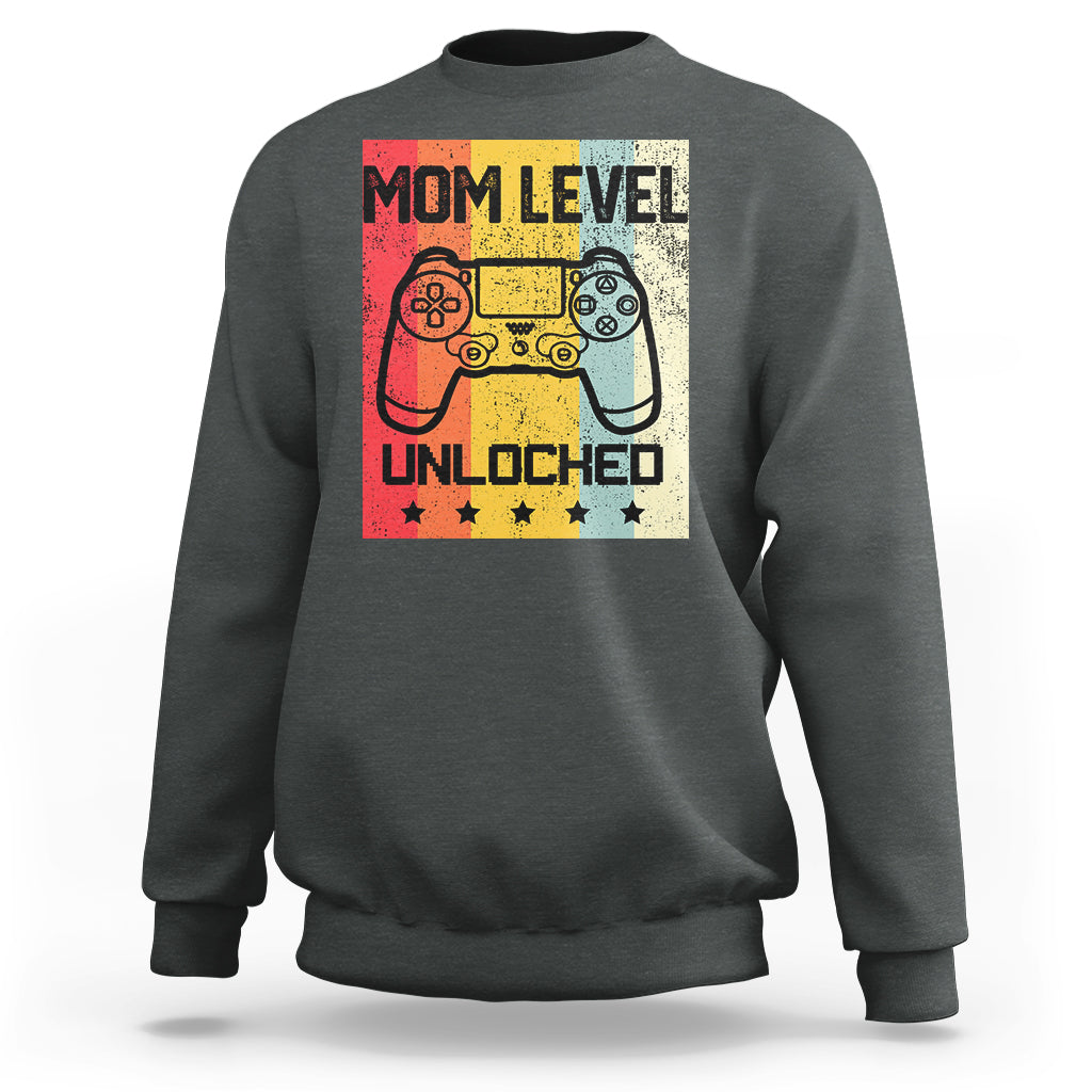 Charcoal crewneck sweatshirt with “Mom Level Unlocked” gaming controller graphic