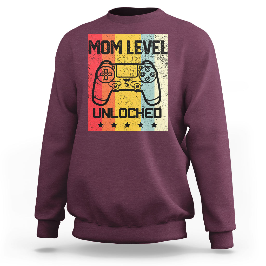 Maroon crewneck sweatshirt with “Mom Level Unlocked” gaming controller graphic