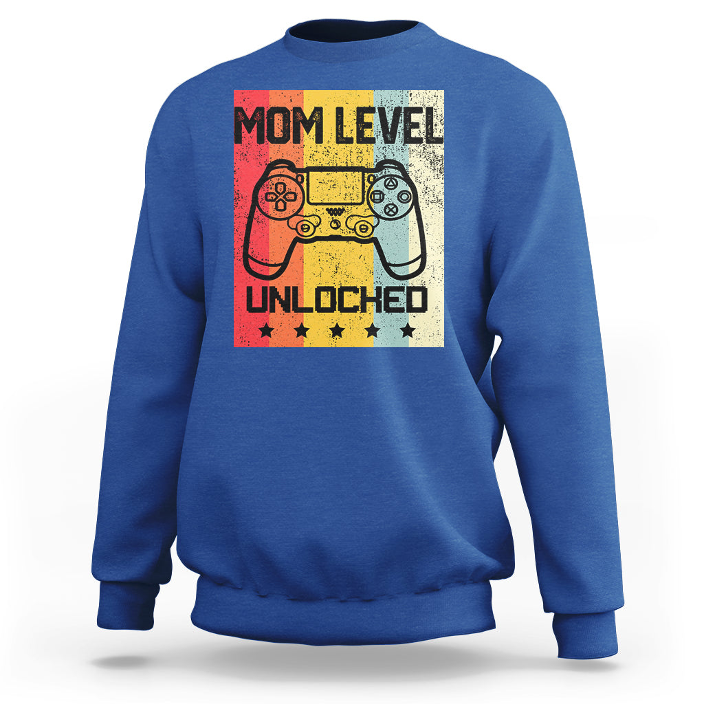 Royal blue crewneck sweatshirt with “Mom Level Unlocked” gaming controller graphic