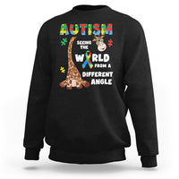 Black crewneck sweatshirt with giraffe puzzle graphic and autism-style slogan on front
