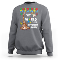 Charcoal crewneck sweatshirt with giraffe puzzle graphic and autism-style slogan on front
