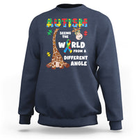 Navy crewneck sweatshirt with giraffe puzzle graphic and autism-style slogan on front