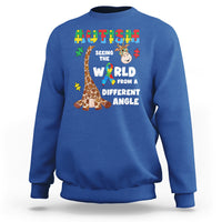Royal blue crewneck sweatshirt with giraffe puzzle graphic and autism-style slogan on front