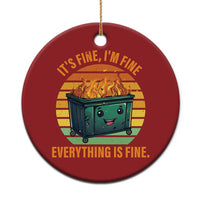 Red round Christmas ornament with burning dumpster graphic and the text “Everything is Fine.”