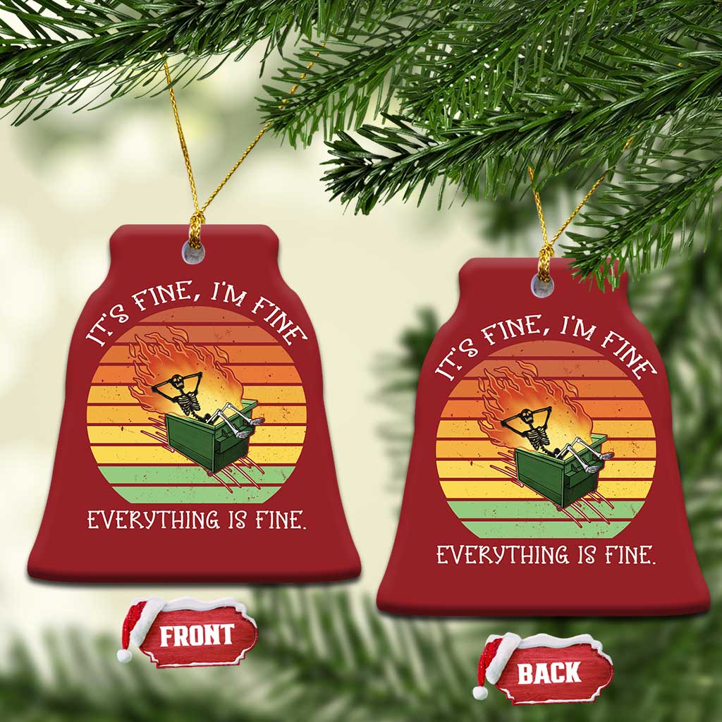 Set of two red bell Christmas ornaments with skeleton fire graphic and gold hanging loops