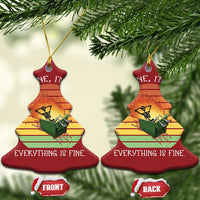 Two red bell-shaped Christmas ornaments with skeleton fire graphic and gold hanging string