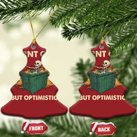 Two red bell-shaped Christmas ornaments with skeleton dumpster graphic and “Burnt out, but optimistic”.