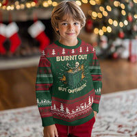 Kids' Christmas sweater in green with skeleton-in-dumpster front, festive fair isle yoke