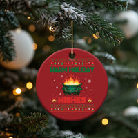 Red round Christmas ornament with gold hanging loop; “Warm Holiday Wishes” text and fire pot graphic.