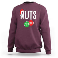 Maroon crewneck sweatshirt with “NUTS” holiday nut graphic and red Santa hat