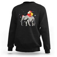 Black crewneck sweatshirt with Santa riding an elephant graphic on the back