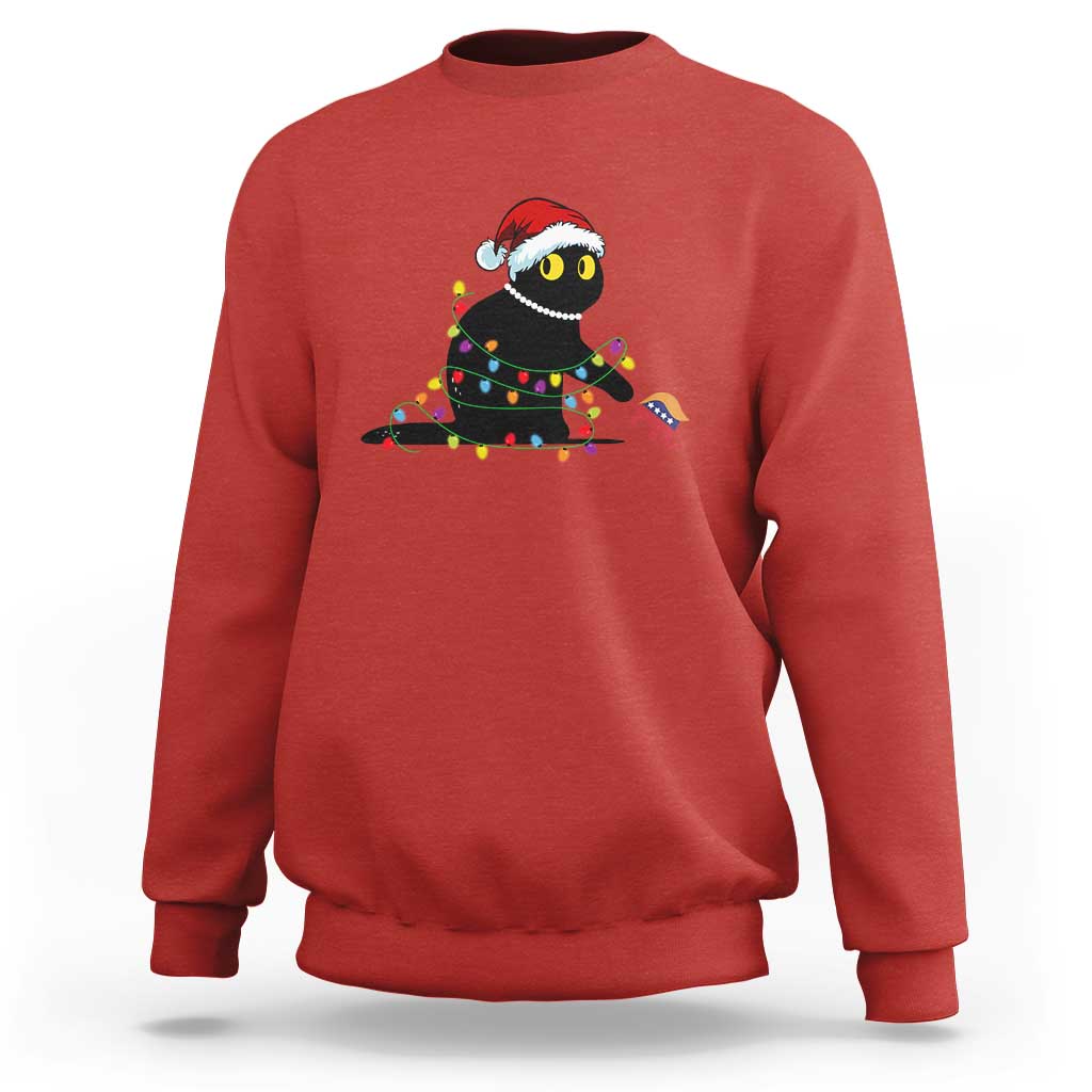 Red crewneck sweatshirt with holiday cat graphic in colorful string lights