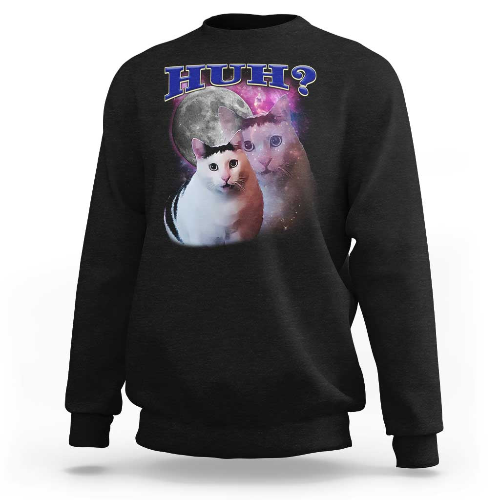Black crewneck sweatshirt with cat graphic and “HUH?” text on the front.