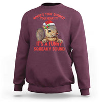 Maroon crewneck sweatshirt with front squirrel graphic and red holiday-style text