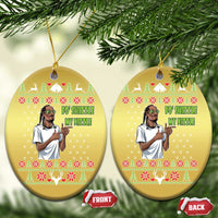 Gold oval Christmas ornaments on pine branches, front and back with rapper meme text.