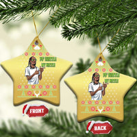 Gold star-shaped Christmas ornaments hanging on pine branches with rapper meme text.