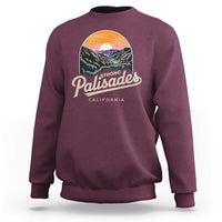 Maroon crewneck sweatshirt with 'Palisades California' landscape graphic on chest