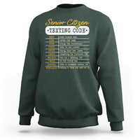 Forest green crewneck sweatshirt with “Senior Citizen Texting Code” front graphic