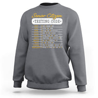 Charcoal gray crewneck sweatshirt with “Senior Citizen Texting Code” front graphic