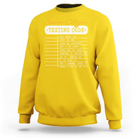 Daisy yellow crewneck sweatshirt with “Senior Citizen Texting Code” front graphic