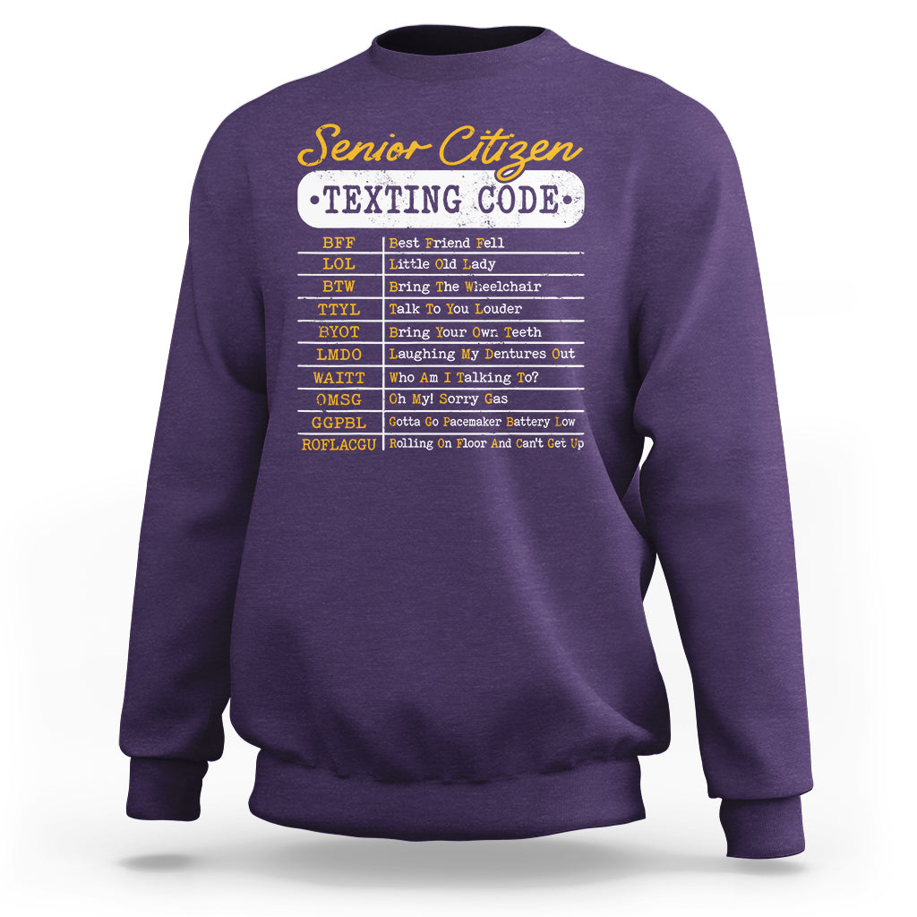 Purple crewneck sweatshirt with “Senior Citizen Texting Code” front graphic