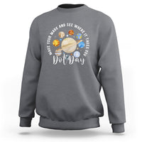 Charcoal crewneck sweatshirt with Dot Day space graphic on the chest