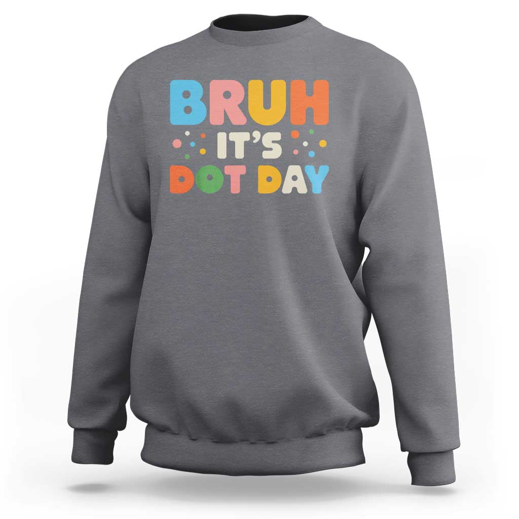 Charcoal gray crewneck sweatshirt with colorful "BRUH IT'S DOT DAY" graphic on back