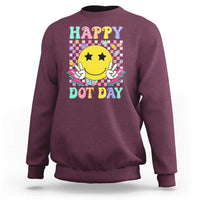 Maroon sweatshirt with “Happy Dot Day” smiley face graphic, long sleeves, crew neck