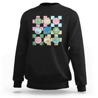 Easter-themed sweatshirt in dark charcoal with colorful bunny-and-egg square graphic