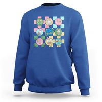 Easter-themed sweatshirt in royal blue with colorful bunny-and-egg square graphic