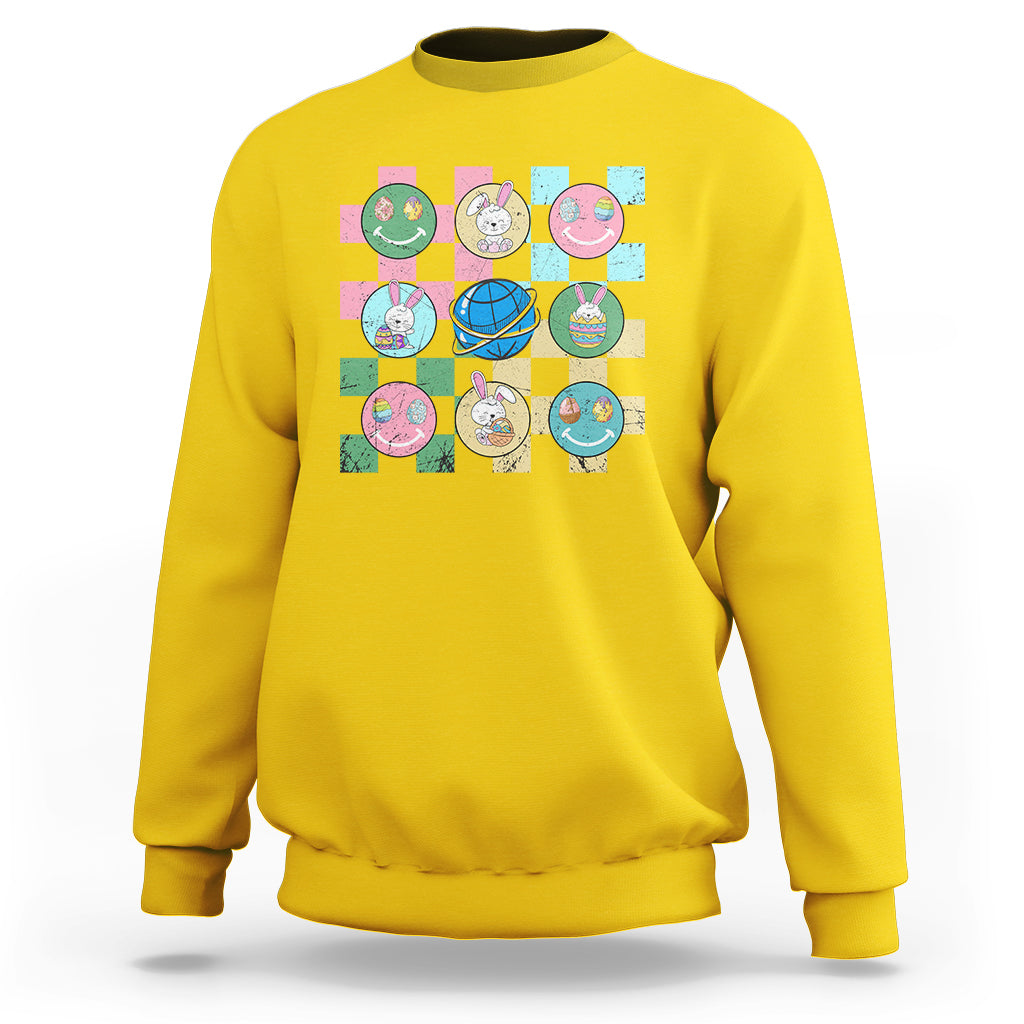 Easter-themed sweatshirt in daisy yellow with colorful bunny-and-egg square graphic