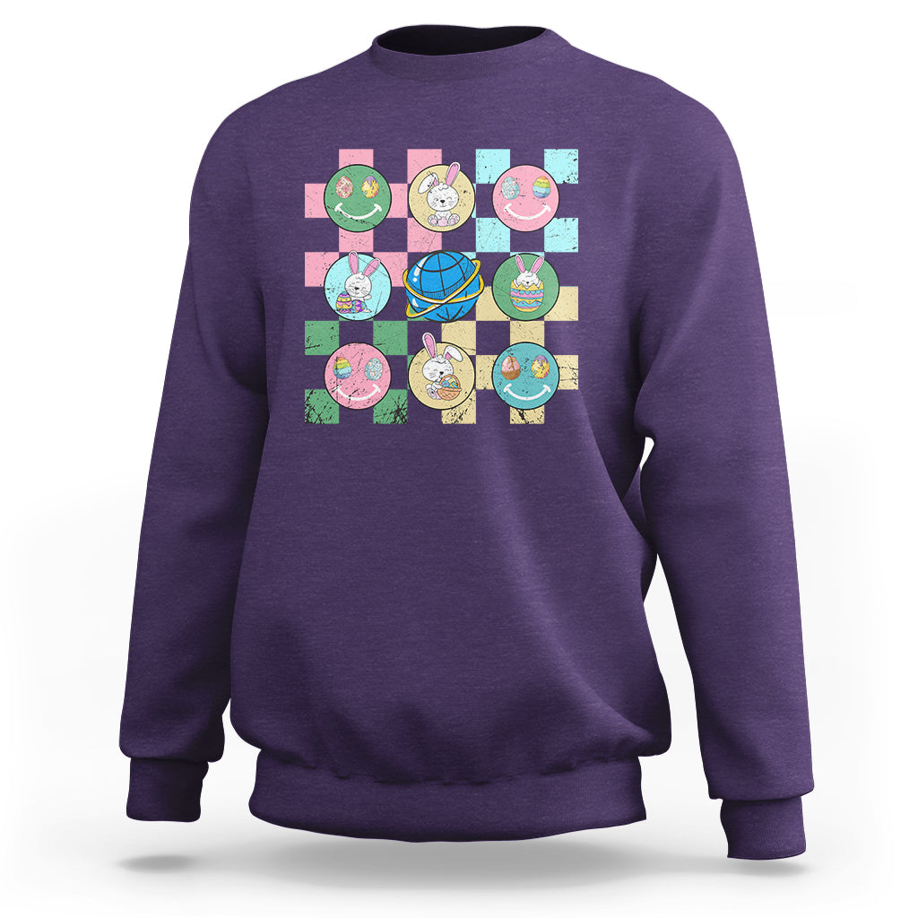 Easter-themed sweatshirt in purple with colorful bunny-and-egg square graphic