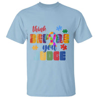 Light blue autism awareness T-shirt with colorful puzzle and “Believe you unite” text graphic