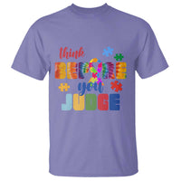 Violet autism awareness T-shirt with colorful puzzle and “Believe you unite” text graphic